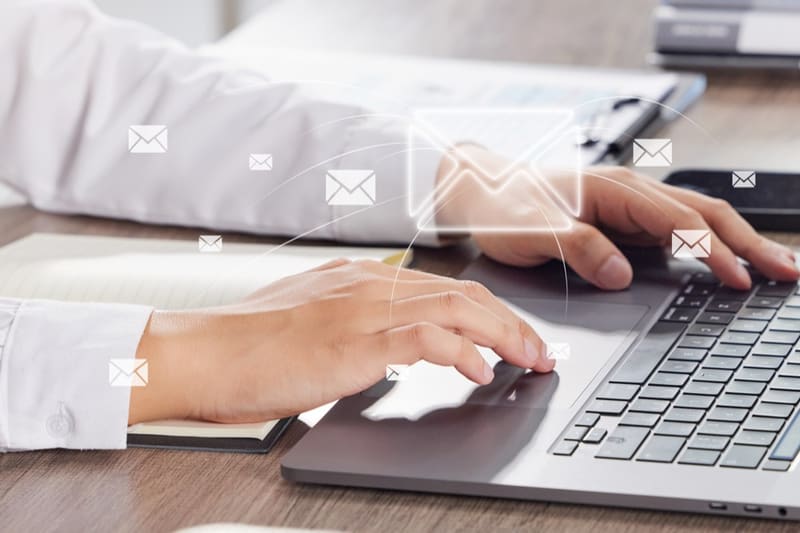 Replying to customer messages on a laptop